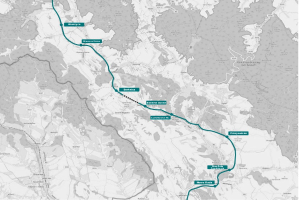 Karte einer Stadt mit einer blauen Linie, die die Route einer Fahrradtour markiert, einschließlich Start- und Endpunkten.