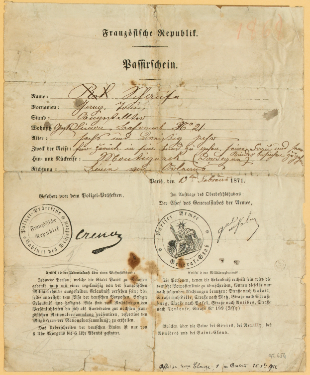 Ein altes, vergilbtes Dokument mit einem kreisförmigen, schwarz umrandeten Stempel, enthält schwarzen Text, wahrscheinlich ein Brief der deutschen Regierung.