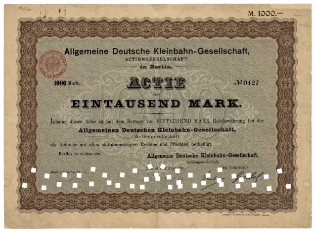 Ein altes deutsches Aktienzertifikat, ausgestellt von der deutschen Regierung, mit Text und einem Stempel.