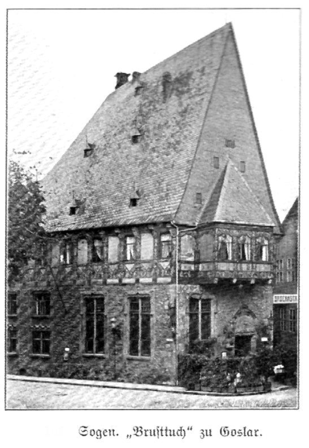 Ein altes Gebäude mit einem dreieckigen Dach, umgeben von Bäumen und Pflanzen, unter einem klaren Himmel, mit dem Text "Goslar, Bruutthüch, Deutschland" unten.